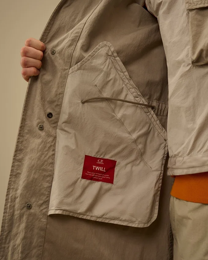 Twill-fishtail-kapp med Lens-detaljer