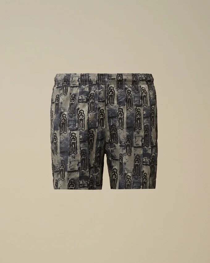 U16 Flatt Nylon-badshorts med tryck